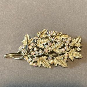 Coro gold tone leaf and AB rhinestone brooch.